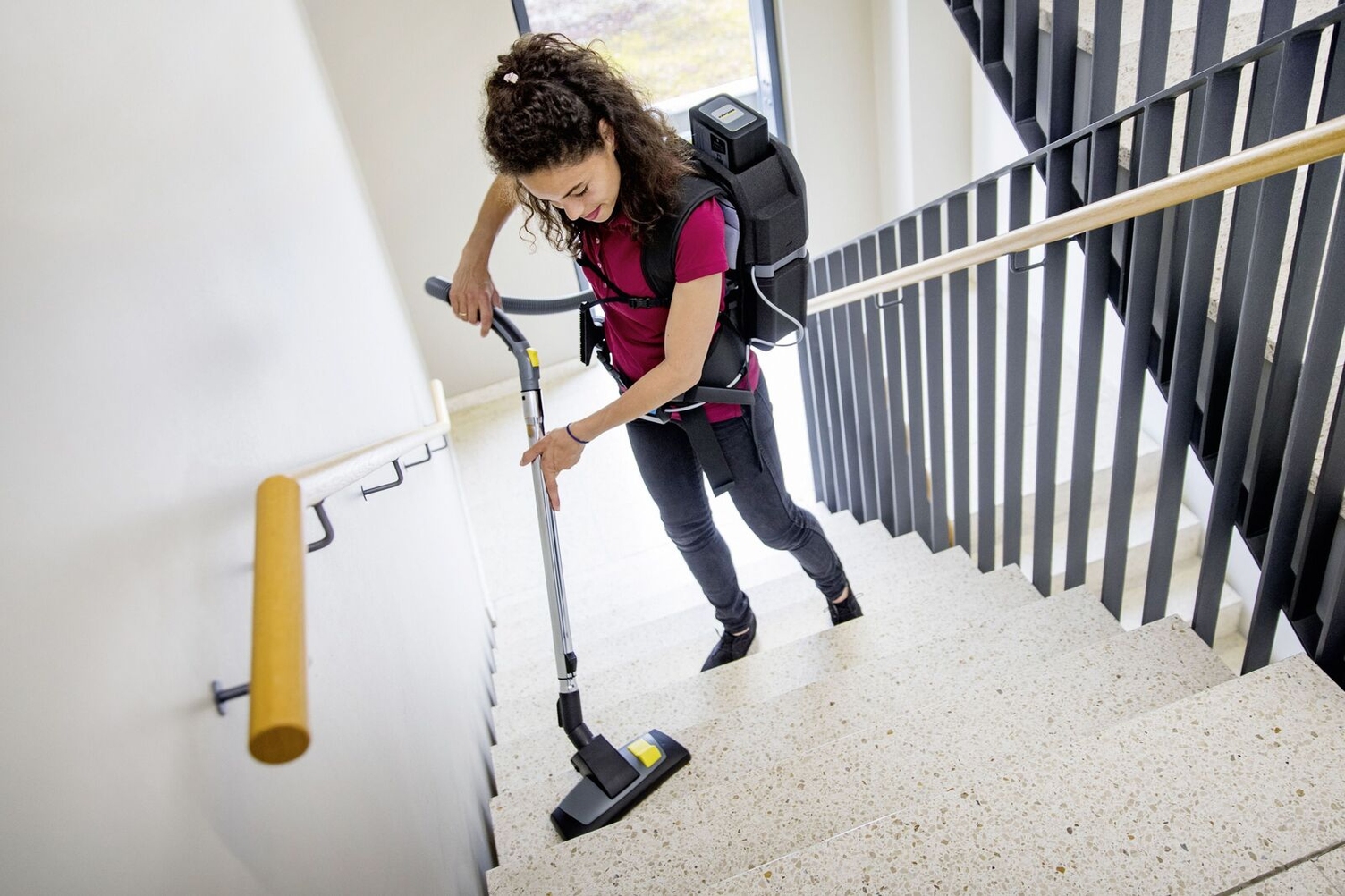 Removing loose dirt with Kärcher backpack vacuum