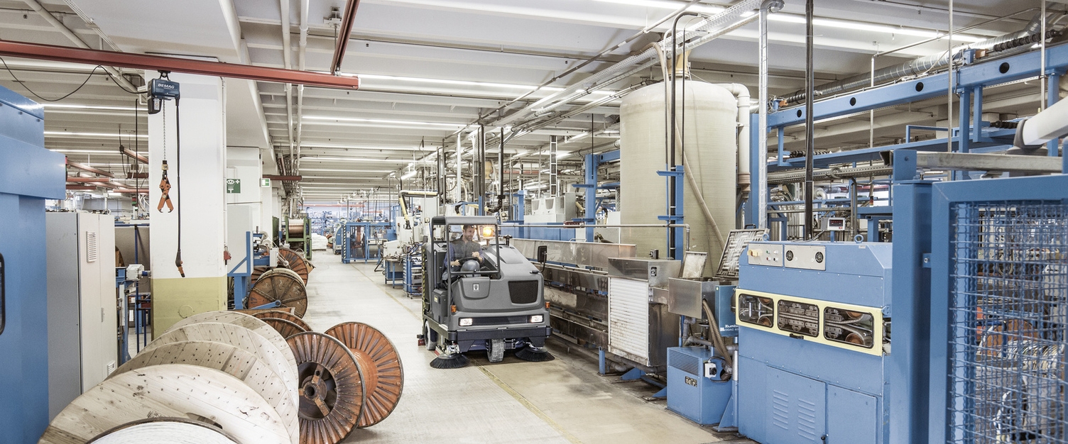 General cleaning tasks in industry: A person cleans the floor in the facility