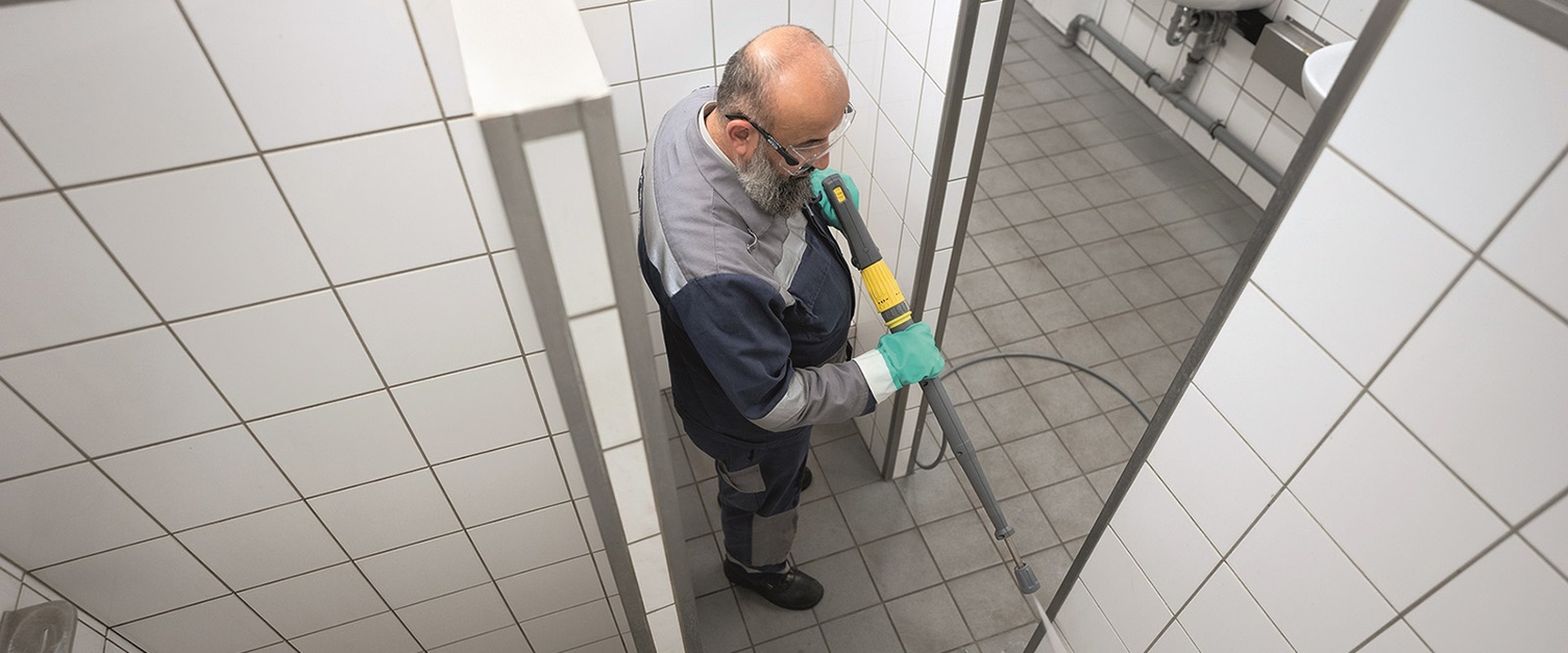 Person using high pressure cleaners for hygienic cleaning