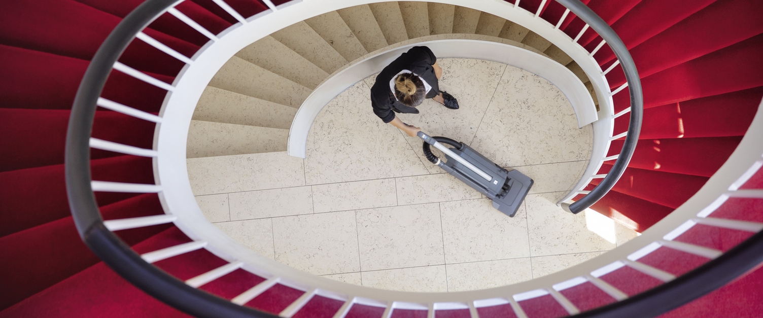 Cleaning in the hospitality sector Cleaning in the hospitality sector with a brush vacuum cleaner