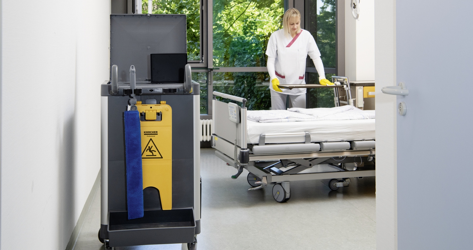 A person is cleaning a patient room