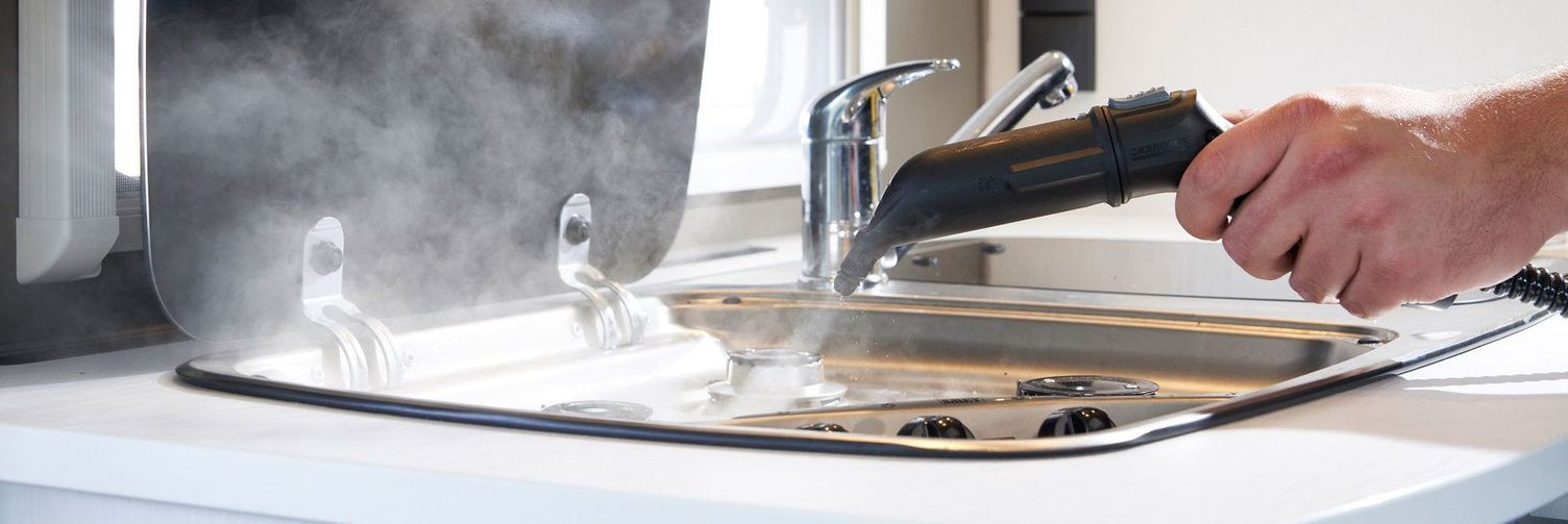 Clean kitchen counter with steam cleaner Cleaning a caravan kitchenette with a Kärcher steam cleaner