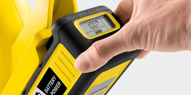 A hand on the battery with LCD display