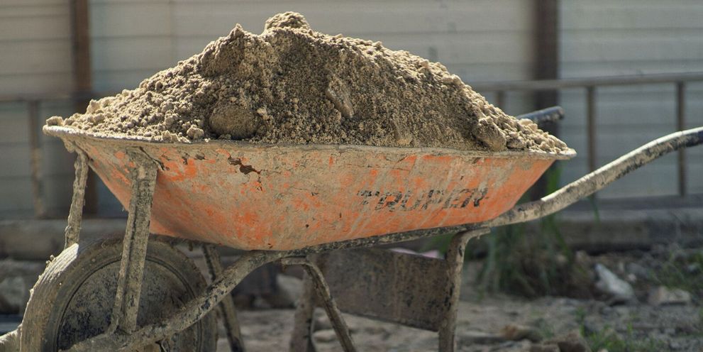 A wheelbarrow filled with soil