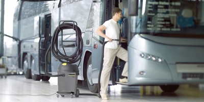Person cleaning a bus