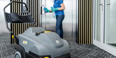 Person cleaning a hotel room Person cleaning a hotel room