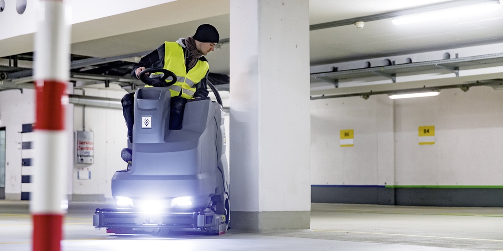 The Kärcher ride-on sweeper in use The Kärcher ride-on sweeper in use