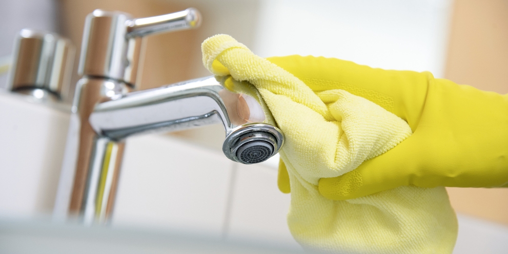 A water tap is cleaned