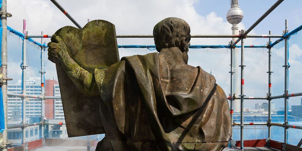 A moss-covered statue