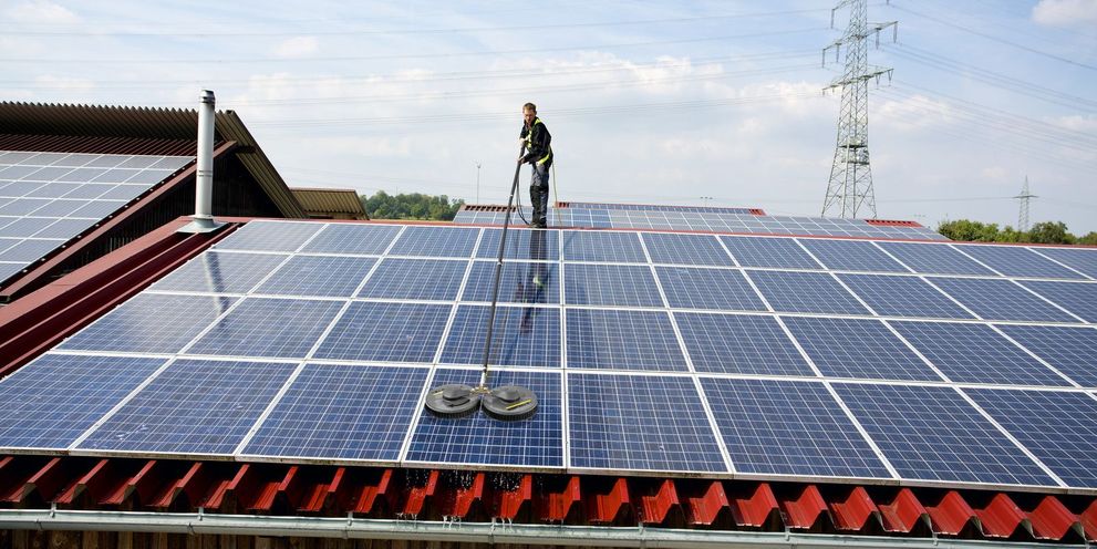 Cleaning solar and photovoltaic panels