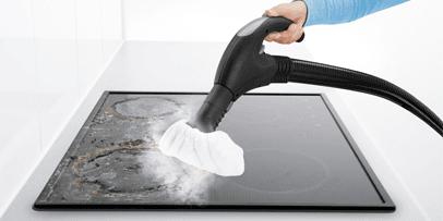 The Kärcher SV 7 steam vacuum cleaner removes burnt-on residues from ceramic hobs using water steam.