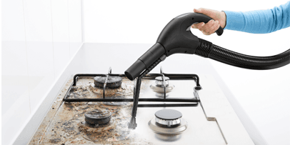 Kärcher SV 7 cleans encrusted areas on a gas stove.