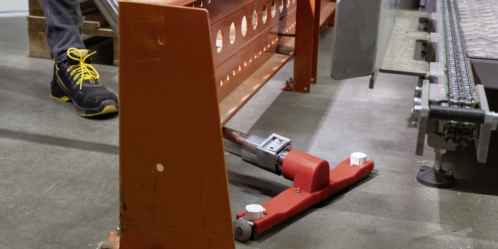 A person cleans the floor with a Kärcher vacuum cleaner