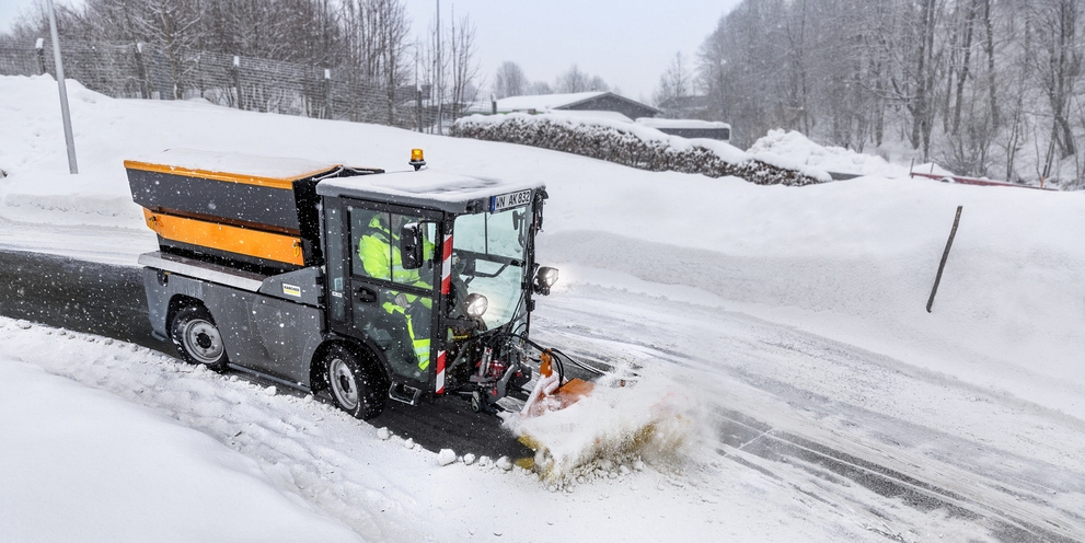 Front sweeper from Kärcher clearing a snow-covered street
