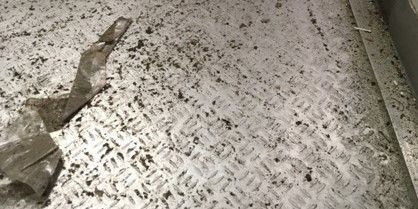 View of a dirty floor made of aluminum.