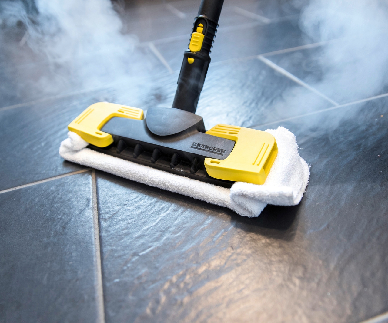 Kärcher steam cleaner disinfecting a tiled floor
