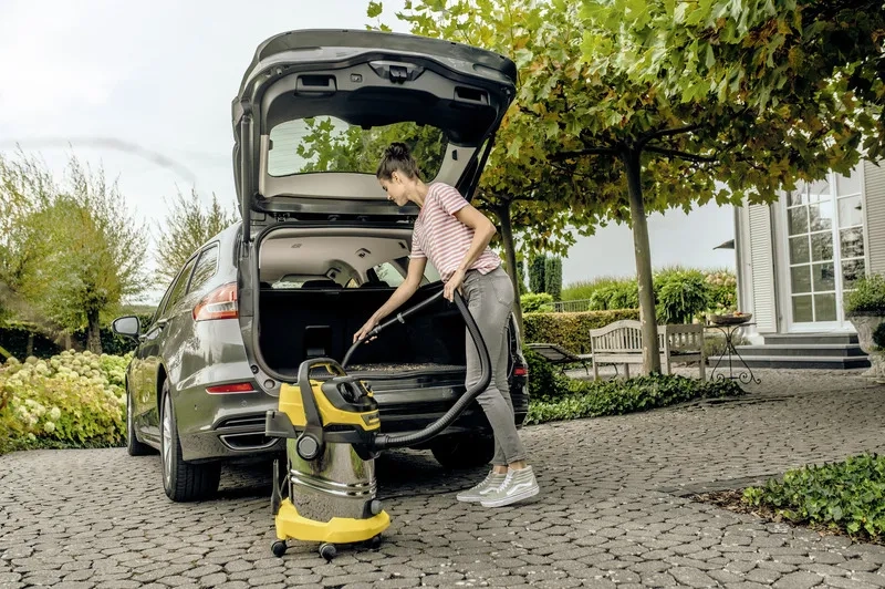 WD Car WD 6 vacuuming the trunk of the car