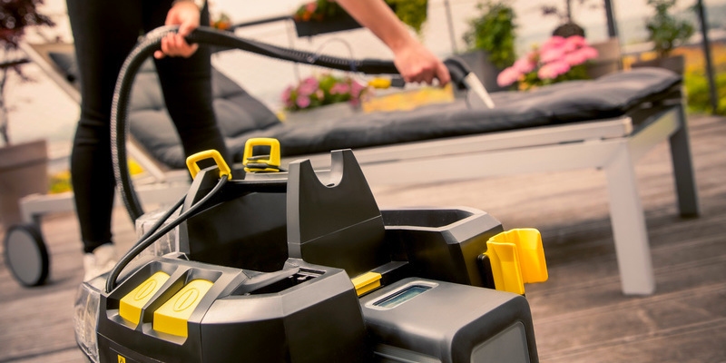 A sun lounger is cleaned with the Puzzi 9/1 Bp