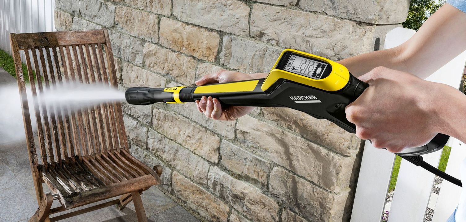 A garden chair being cleaned with a Kärcher pressure washer
