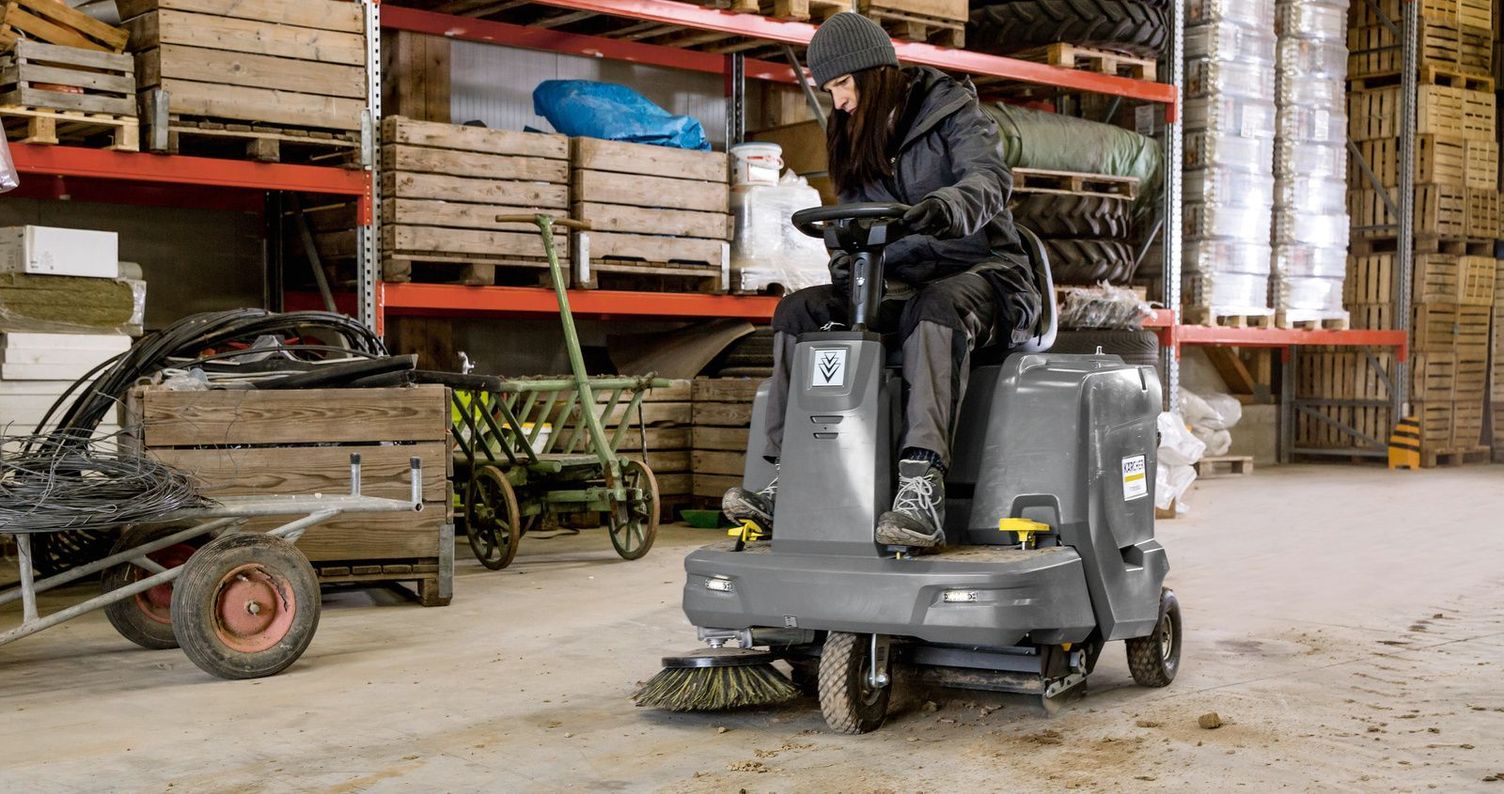 Farming warehouse cleaning with a Kärcher sweeper ride-on