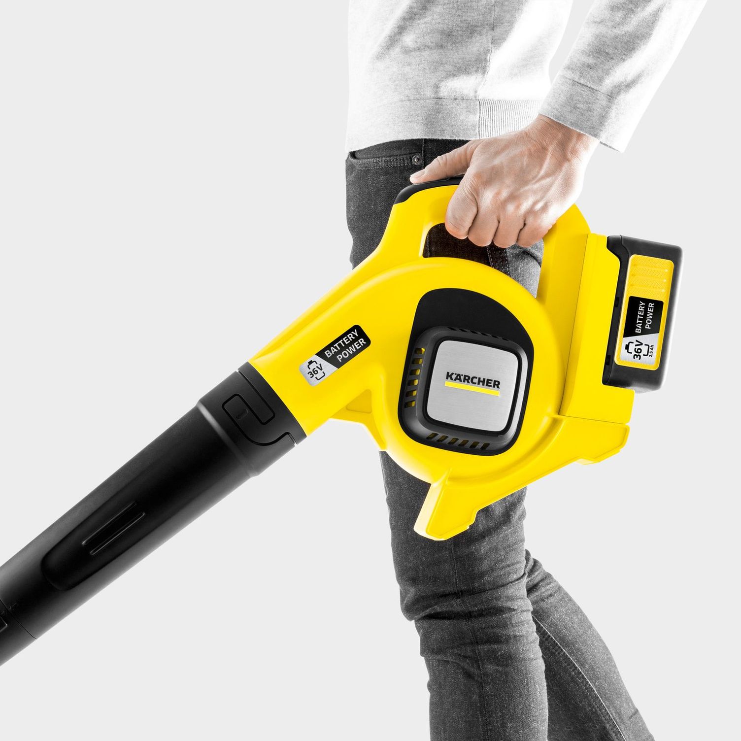 A person carries the Kärcher cordless leaf blower