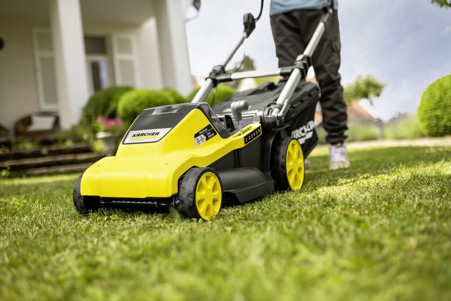 Mowing the lawn with a Kärcher lawn mower