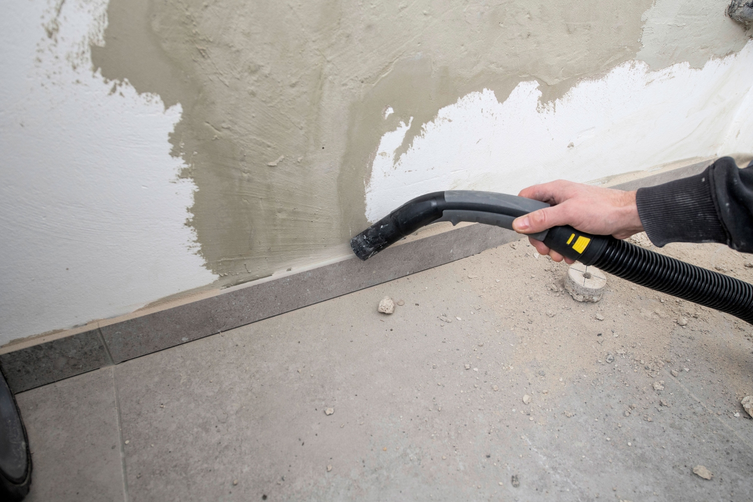 Vacuuming construction rubble on a construction site