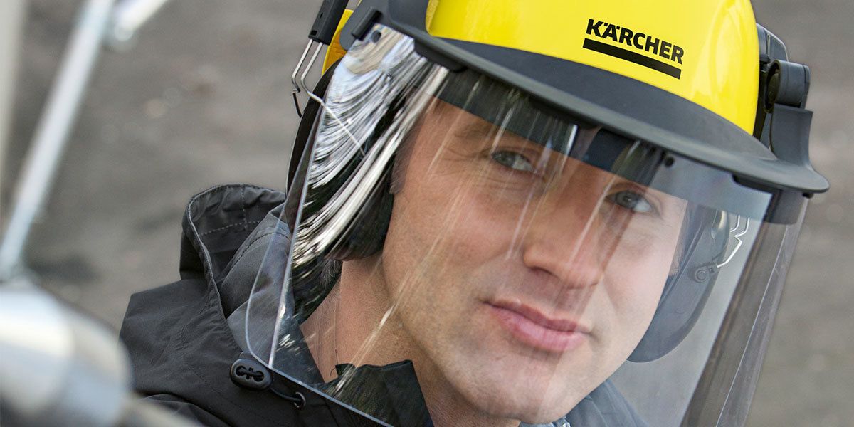 A person with a Kärcher safety helmet