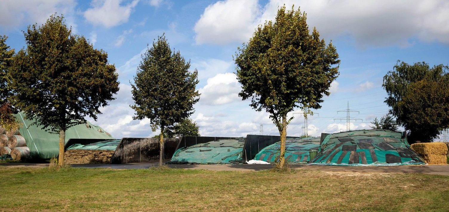 Substrate storage under green trees in a meadow