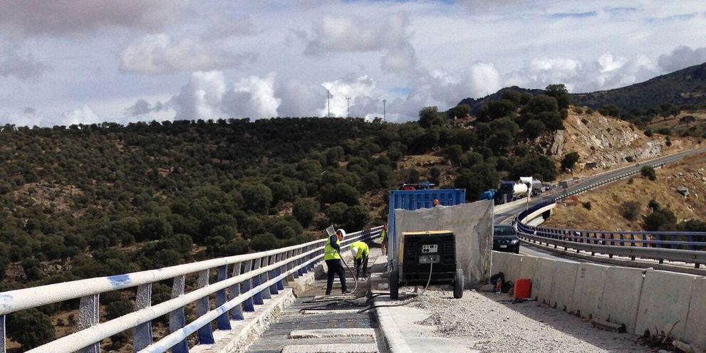 A bridge with exposed concrete framework