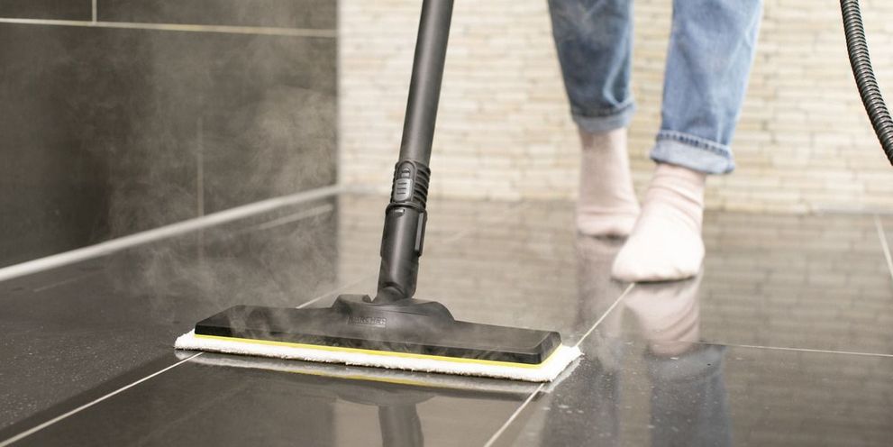 Floor cleaning with steam cleaner Person cleaning floor using Kärcher steam cleaner