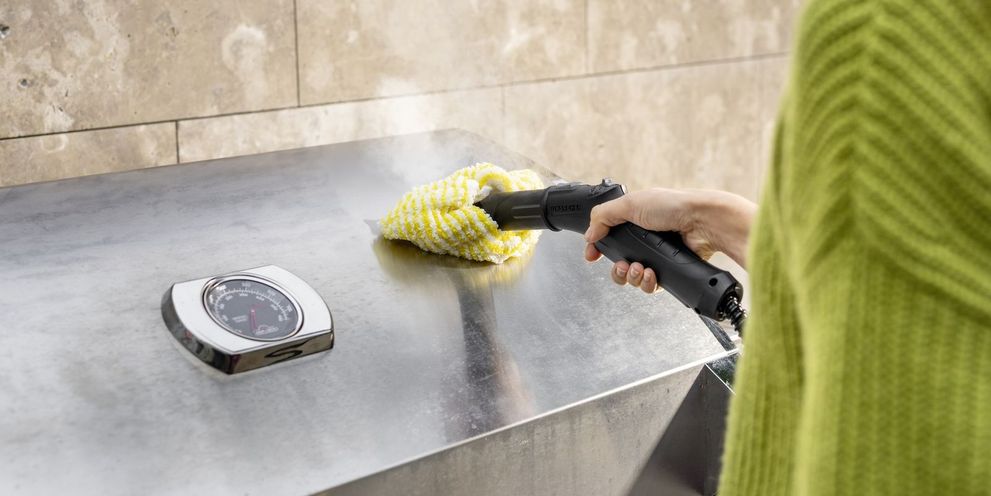 Grill hood cleaning with a steam cleaner