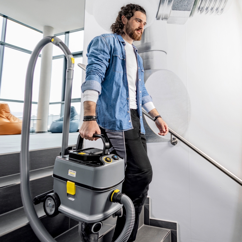 Vacuum cleaner T 10 1 BP carrying down the stairs Vacuum cleaner T 10 1 BP carrying down the stairs