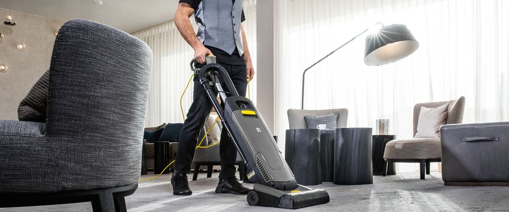 Upright brush-type vacuum cleaners in reception areas