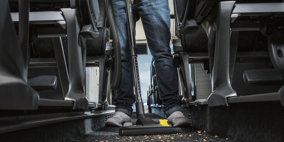 Cleaning a bus with a battery-powered dry vacuum cleaner Cleaning a bus with a Kärcher battery-powered dry vacuum cleaner