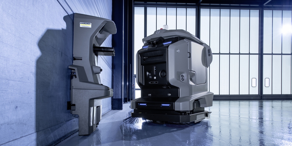 Karcher KIRA robot-schrobmachine bij zijn docking station. Karcher KIRA robot-schrobmachine bij zijn docking station.