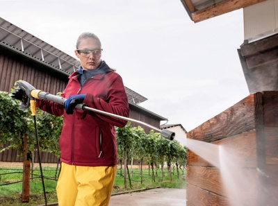 Person cleaning in an agricultural business