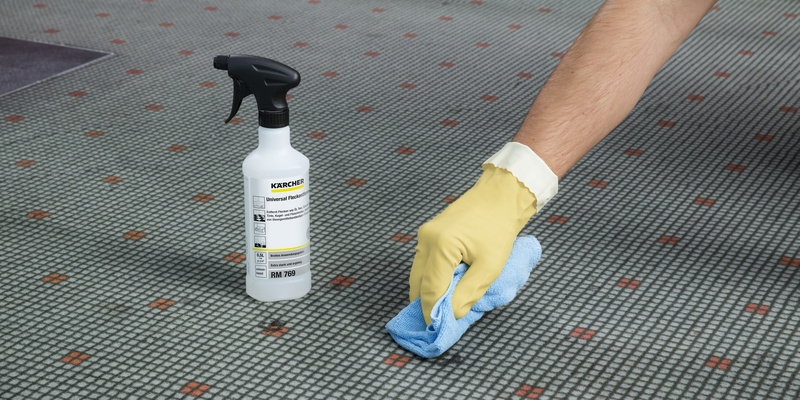 A stain being removed from a carpet using a universal cleaner