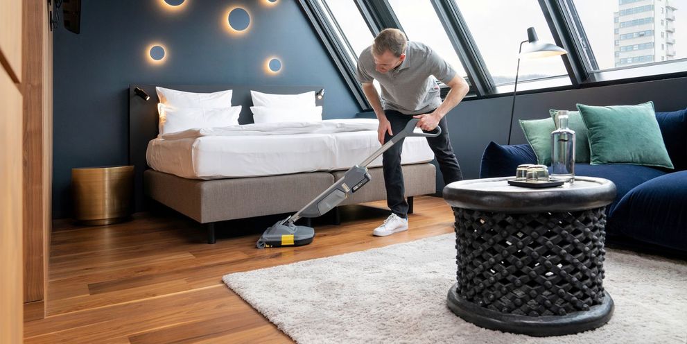 Cleaning the hotel room floor with scrubber dryer