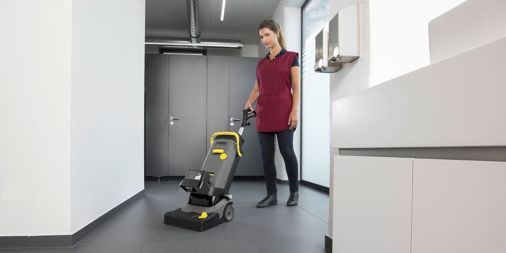 Floor cleaning in sanitary areas with a scrubber drier