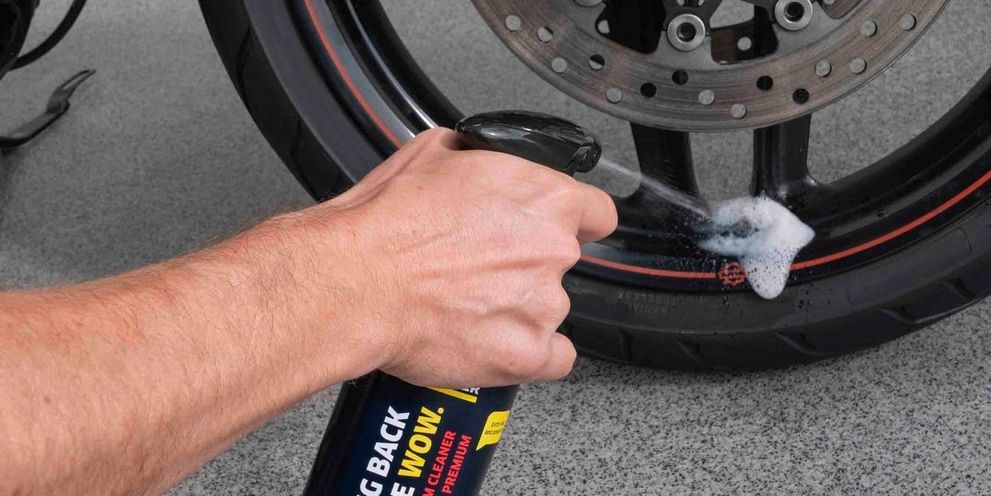 Kärcher rim cleaner is sprayed onto the motorcycle rims