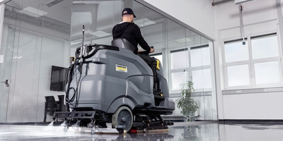 Spraying disinfectant with a scrubber dryer