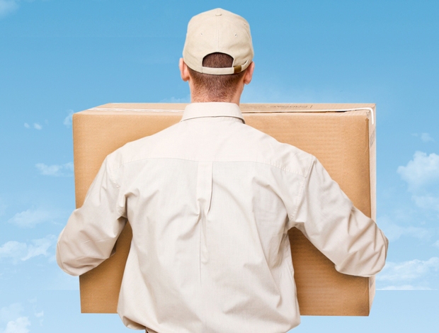 Person shown from the back holding a package