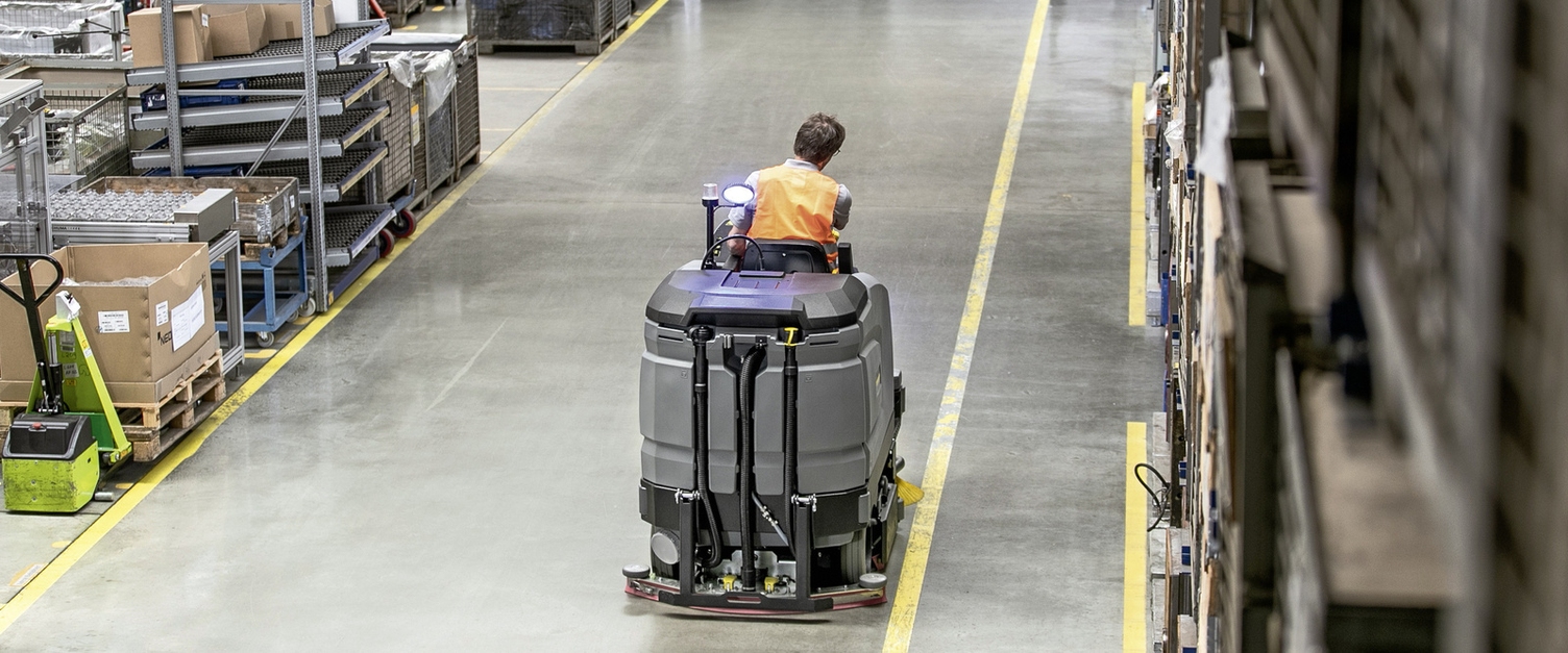 Scrubber dryer is cleaning logistics center Scrubber dryer is cleaning logistics center