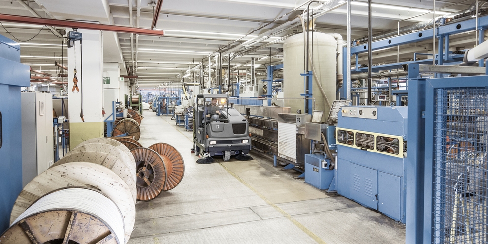 Scrubber dryer is cleaning manufacturing plant Scrubber dryer is cleaning manufacturing plant