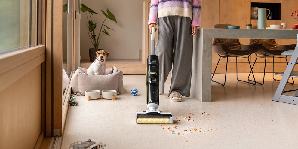 Vaccum mop cleaning stone floor in the dining room