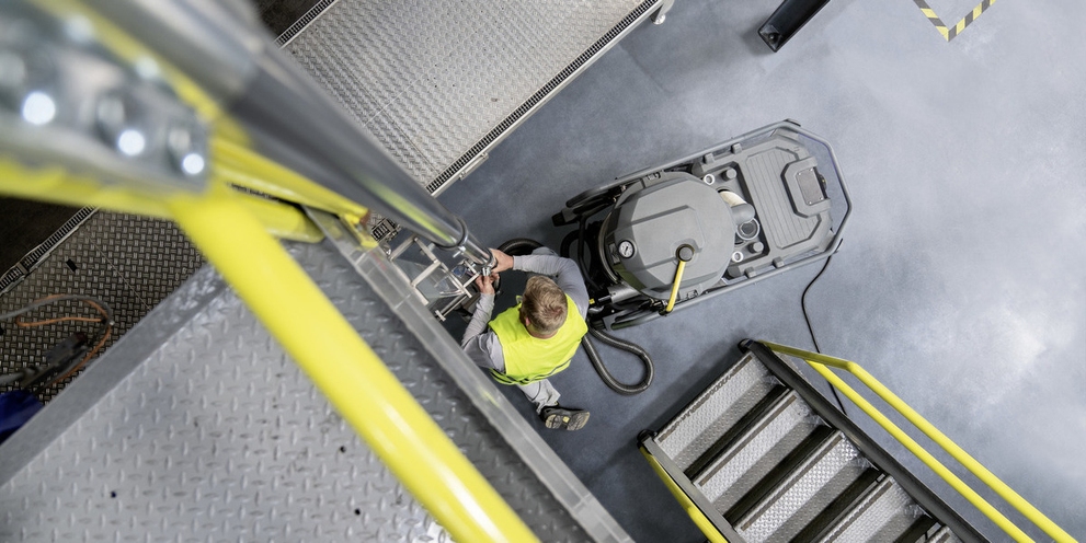 Top view of person cleaning with Kärcher machine Top view of person cleaning with Kärcher machine