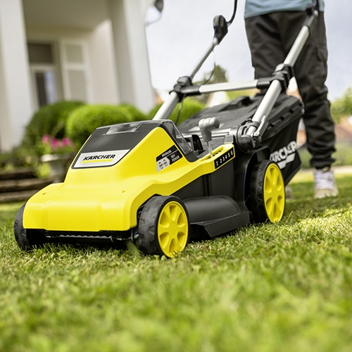 Lawn mower mowing the lawn with brushless motor
