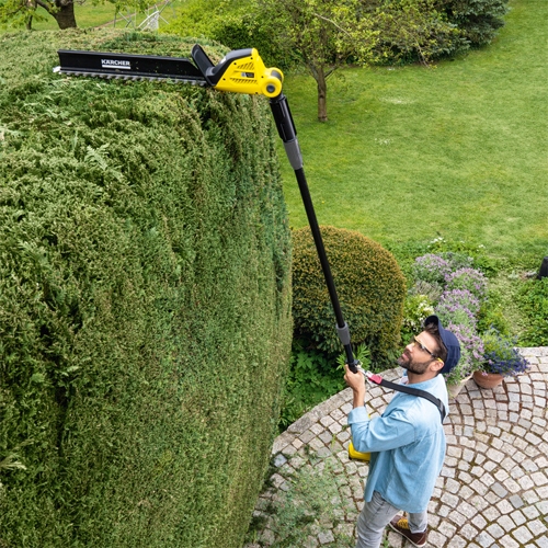 Adjustable cutting head for pole hedge trimming in different angles