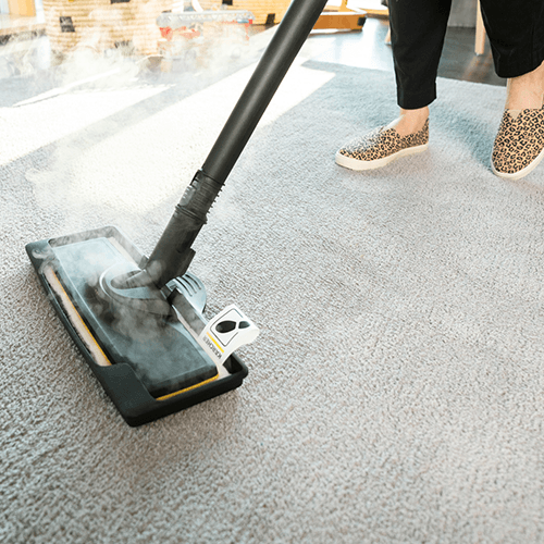 Cleaning the carpet with Kärchr steam cleaner